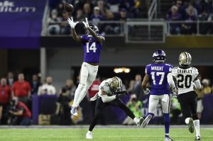 MINNEAPOLIS, MN - JANUARY 14: Stefon Diggs #14 of the Minnesota Vikings leaps to catch the ball in the fourth quarter of the NFC Divisional Playoff game against the New Orleans Saints on January 14, 2018 at U.S. Bank Stadium in Minneapolis, Minnesota. Diggs scored a 61-yard touchdown to win the game 29-24. (Photo by Hannah Foslien/Getty Images)